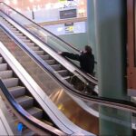 Ride up an escalator in a wheelchair